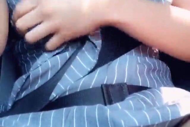 Brunette woman masturbating in the car